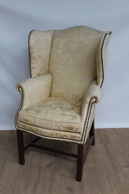 Lot 1342 - 19th century wing arm chair of good proportions, upholstered in yellow silk fabric, on mahogany legs joined by stretchers