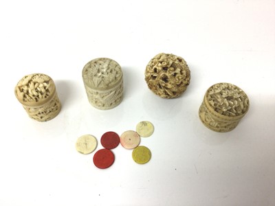 Lot 34 - Three 19th century Chinese carved ivory boxes, together with an ivory ball carved with dragons and a small quantity of counters