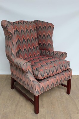 Lot 1360 - Georgian-style wing armchair upholstered in brightly coloured fabric, with loose cushion