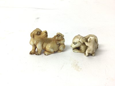 Lot 40 - Two 19th century Japanese ivory 'dog and puppy' netsuke