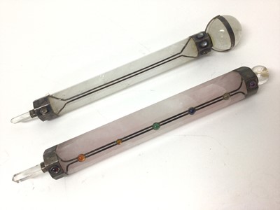 Lot 57 - Rose quartz chakra/healing wand and one other quartz wand, both with white metal mounts