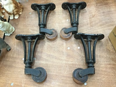 Lot 402 - Set of four 19th century cast iron and lignum vitae castors of large proportions
