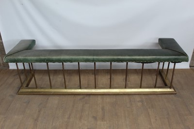 Lot 1411 - Brass and green leather upholstered club fender