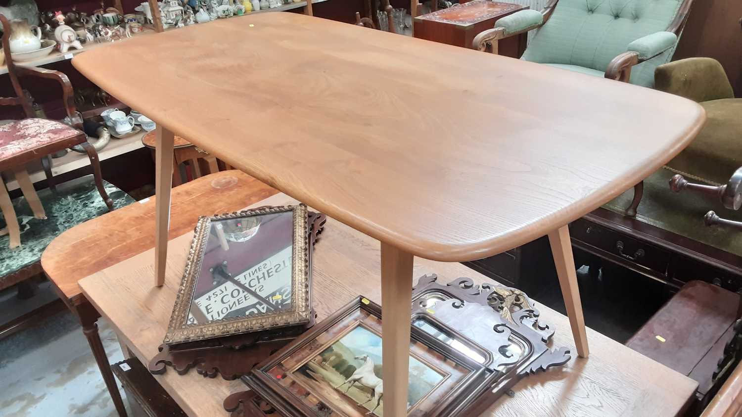 Lot 895 - Good quality Ercol dining table on splayed legs, 151cm x 75cm, together with a matching set of six stick back chairs comprising four standards and two carvers