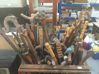 Lot 40 - Collection of novelty walking sticks and thumb sticks in wooden stand ( 50 plus )