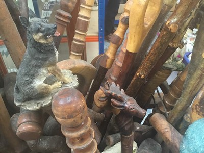 Lot 40 - Collection of novelty walking sticks and thumb sticks in wooden stand ( 50 plus )