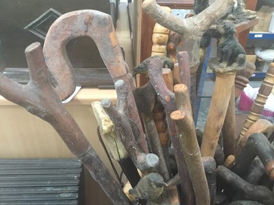 Lot 40 - Collection of novelty walking sticks and thumb sticks in wooden stand ( 50 plus )