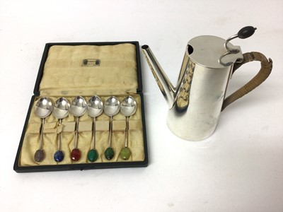 Lot 129 - Sterling silver cafe au lait pot with flying coffee bean thumb rest, together with a cased set of six silver coffee spoons with semi-precious coffee bean terminals, retailed by Liberty