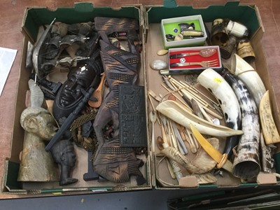Lot 385 - Two boxes of African tribal masks and carvings, horn and bone items