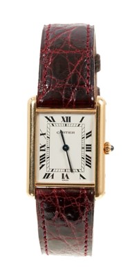Lot 643 - Gentlemen’s Cartier 18ct gold Tank wristwatch with quartz movement,in tank shape 18ct yellow gold case on Cartier leather strap with gold plated buckle. Case approximately 30.5mm x 23mm. Presentati...