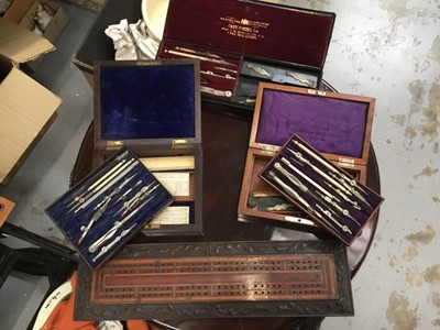 Lot 64 - Three 19th century mathematical instrument sets and inlaid cribbage board