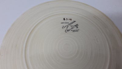 Lot 1025 - Three Clarice Cliff plates, together with a Celtic Harvest preserve pot (4)