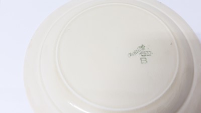 Lot 1025 - Three Clarice Cliff plates, together with a Celtic Harvest preserve pot (4)