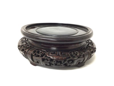 Lot 220 - Good quality antique Chinese carved wooden stand, 21cm diameter (will fit vase with base diameter of 16cm)
