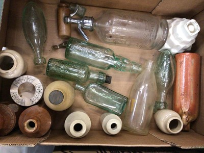 Lot 440 - Slip ware dishes, antique glass bottles, salt glazed bottles and spirit barrel