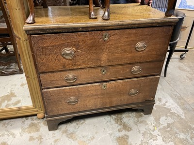 Lot 1013 - George III oak chest of drawers of unusual proportions with three long drawers