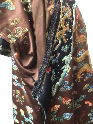 Lot 2057 - 19th Century Chinese embroidered brown silk robe with Horse Hoof cuffs, five Dragons and pale blue silk lining.