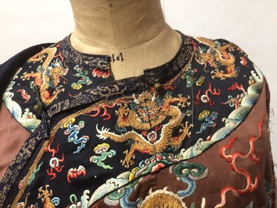 Lot 2057 - 19th Century Chinese embroidered brown silk robe with Horse Hoof cuffs, five Dragons and pale blue silk lining.