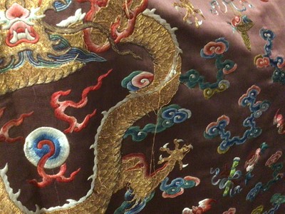Lot 2057 - 19th Century Chinese embroidered brown silk robe with Horse Hoof cuffs, five Dragons and pale blue silk lining.