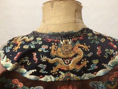 Lot 2057 - 19th Century Chinese embroidered brown silk robe with Horse Hoof cuffs, five Dragons and pale blue silk lining.