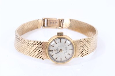 Lot 660 - Ladies Omega 9ct gold wristwatch on integral gold milanese bracelet