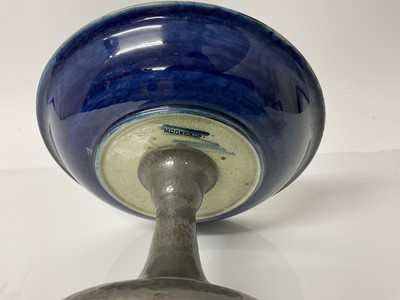 Lot 1039 - Moorcroft pottery tazza decorated in the pomegranate pattern on blue and green ground, on Tudric pewter base, impressed marks and blue painted signature, 13cm high, 19cm diameter