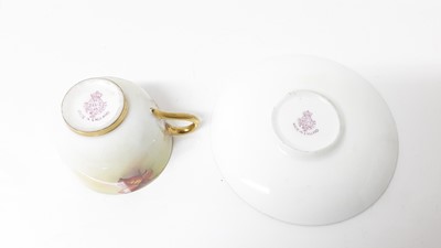 Lot 1067 - Royal Worcester cabinet cup and saucer with hand painted floral decoration, signed K.Blake