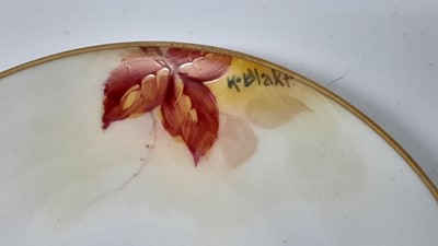 Lot 1067 - Royal Worcester cabinet cup and saucer with hand painted floral decoration, signed K.Blake