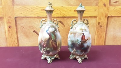 Lot 1309 - Pair of Worcester vases of pheasants and peacocks by Jarman and Powell