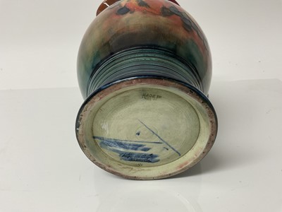 Lot 1105 - Moorcroft pottery Flambe jug decorated in the leaf and berry pattern, impressed marks and blue painted signature to base, 20.5cm high