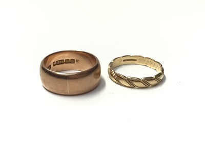 Lot 117 - 9ct rose gold thick band wedding ring and one other 9ct gold wedding ring (2)