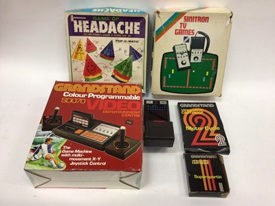 Lot 1878 - Selection of Children's computer and board games including Sinitron Space Invaders, Stylophone, Grand Stand Video Entertainment Center and others. In six boxes.