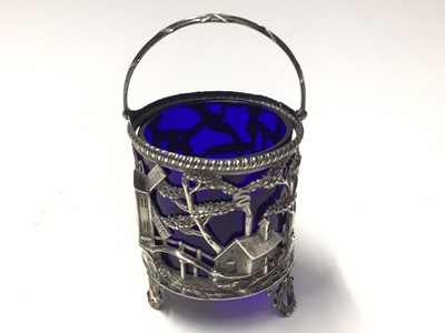 Lot 134 - Georgian silver sugar basket with pierced windmill, house and cow decoration