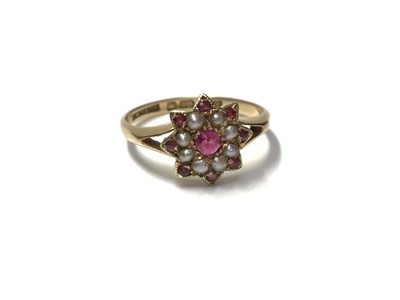 Lot 155 - Edwardian 18ct gold ruby and seed pearl flower head cluster ring