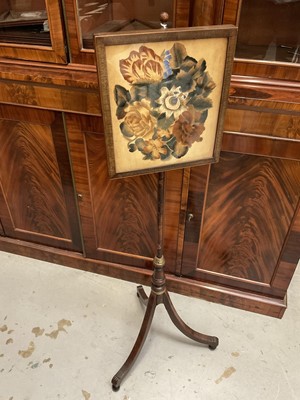 Lot 1312 - Regency mahogany polescreen with painted floral banner