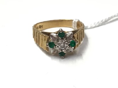 Lot 187 - 18ct gold emerald and diamond cluster ring