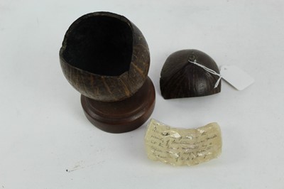 Lot 860 - Second World War Naval interest- coconut tobacco box made from a single coconut with removable cover, together with a note of provenance dated 1941: “This nut was picked in the vicinity of Freetown...
