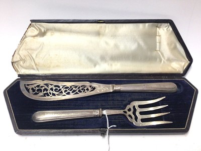 Lot 216 - Pair of Victorian silver fish servers with pierced and engraved decoration, (Sheffield 1856), in fitted case.