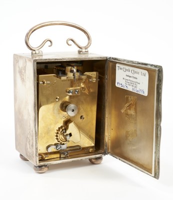 Lot 601 - Archibald Knox style silver carriage clock.
