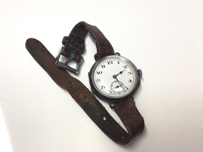 Lot 321 - First World War period silver trench wrist watch with white enamel arabic numeral dial with subsiduary seconds, (import marks for Birmingham 1911), on leather strap.