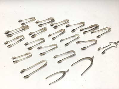 Lot 334 - Twenty pairs of Victorian and early 20th century silver sugar tongs,  various dates and makers, all at approximately 10oz, (20)