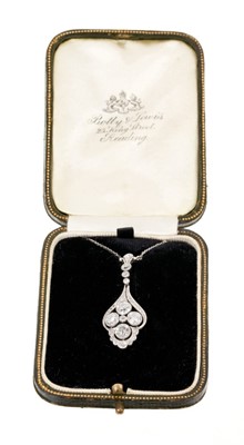 Lot 524 - Edwardian diamond pendant with a quatrefoil cluster of four old cut diamonds in openwork millegrain setting with old cut, single cut and rose cut diamonds, suspended from a trace chain with box cla...