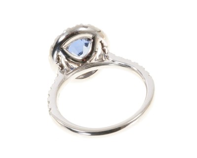 Lot 578 - Sapphire and diamond cluster ring with a cushion cut unheated Burmese blue sapphire weighing 2.02cts surrounded by a 'halo' mount of brilliant cut diamonds with further diamonds to the shoulder...
