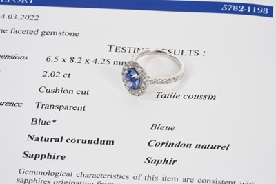 Lot 578 - Sapphire and diamond cluster ring with a cushion cut unheated Burmese blue sapphire weighing 2.02cts surrounded by a 'halo' mount of brilliant cut diamonds with further diamonds to the shoulder...