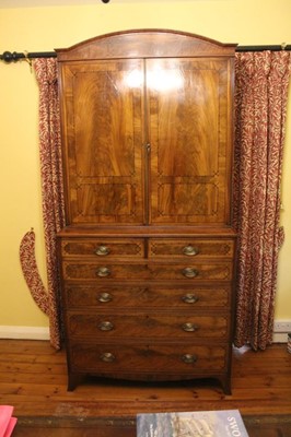 Lot 1200 - Good quality Regency inlaid mahogany two height bookcase with flame mahogany veneers and inlaid ebony dots and stringing, the top with domed pediment and adjustable shelves enclosed two doors, the...