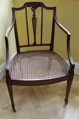 Lot 1205 - Good quality Edwardian neoclassical revival Hepplewhite style bergere chair with carved floral decoration and satinwood inlaid splat, open scroll arms, caned seat of square taper legs terminating o...