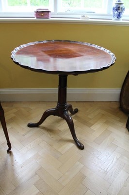 Lot 1207 - George III mahogany tripod supper / tea table with piecrust tilt top on birdcage mechanism, turned cannon barrel column on three hipped splayed legs terminating on pad feet. Approximately 82cm
