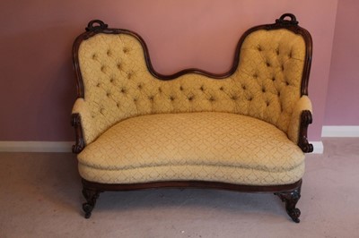 Lot 1215 - Good quality Victorian rosewood framed double ended sofa upholstered in buttoned material, carved rosewood show wood frame on scroll feet