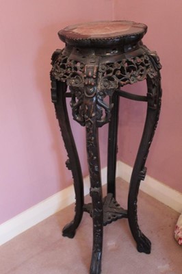 Lot 1217 - Late 19th century Chinese carved rosewood plant stand with rouge marble inlaid top, carved apple blossom frieze and undertier