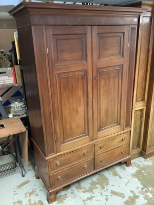 Lot 1222 - George III mahogany wardrobe enclosed by two panelled doors and four drawers below on bracket feet, 139cm wide x 207cm high x 59cm deep